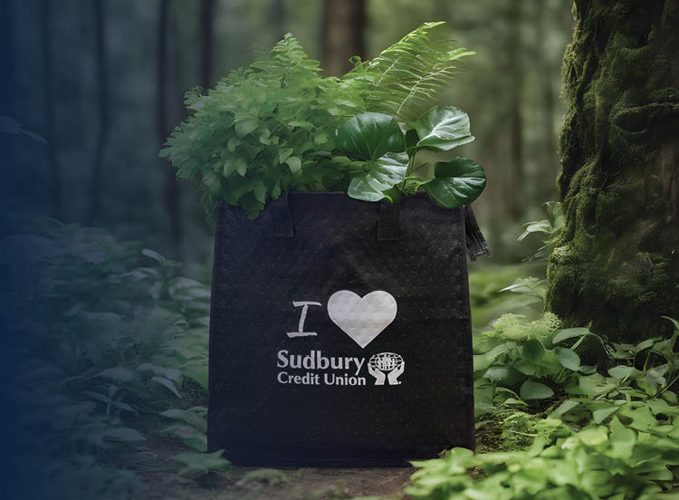SCU tote bag filled with plants in the forest