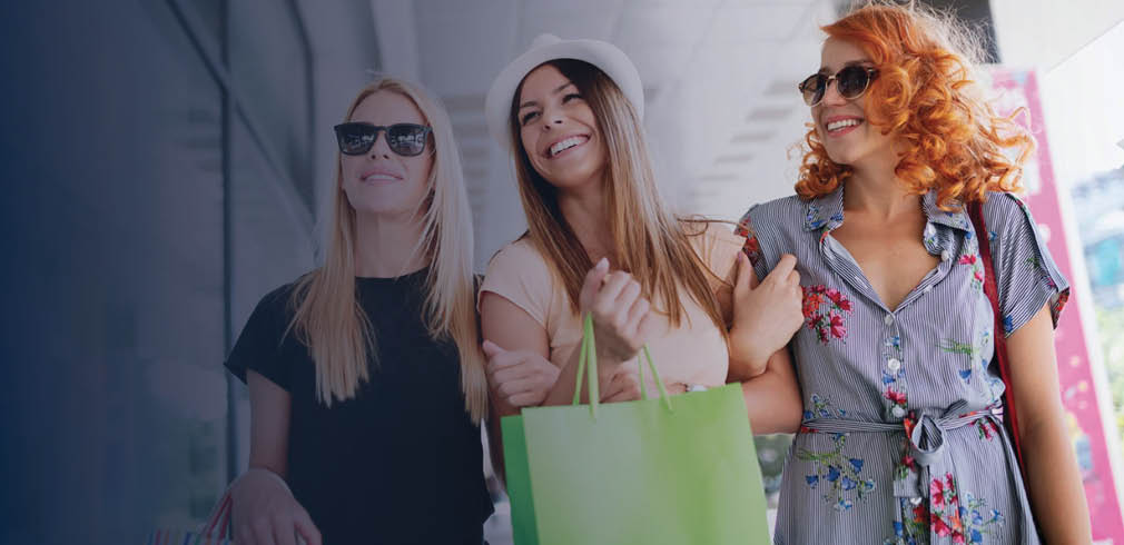 Three women shopping.