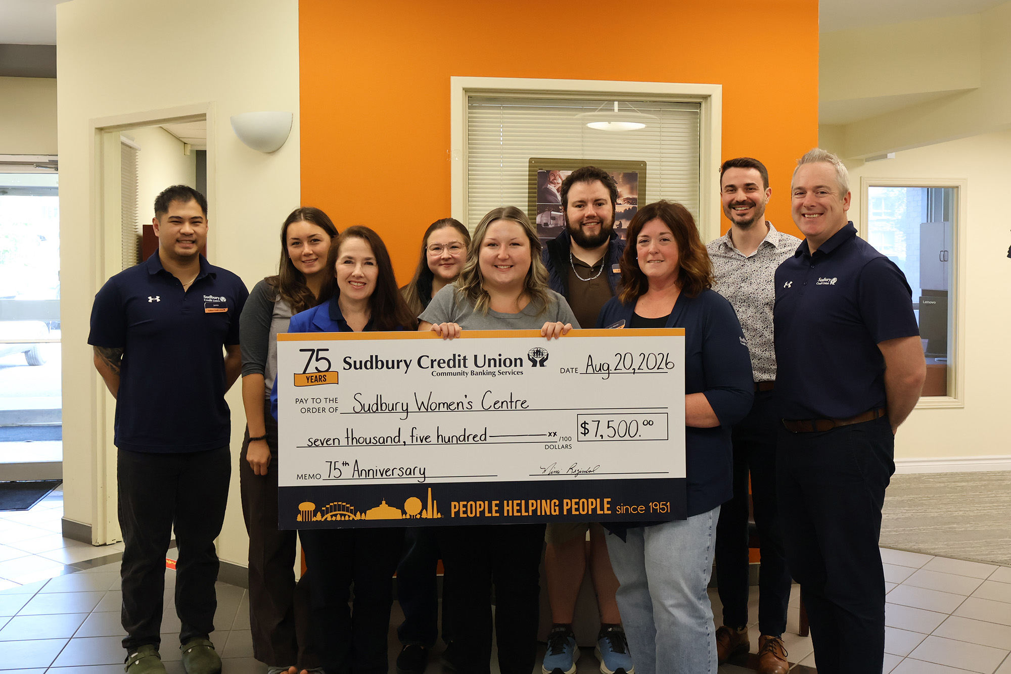 SCU staff present a cheque for $7,500 to the Sudbury Women's Centre